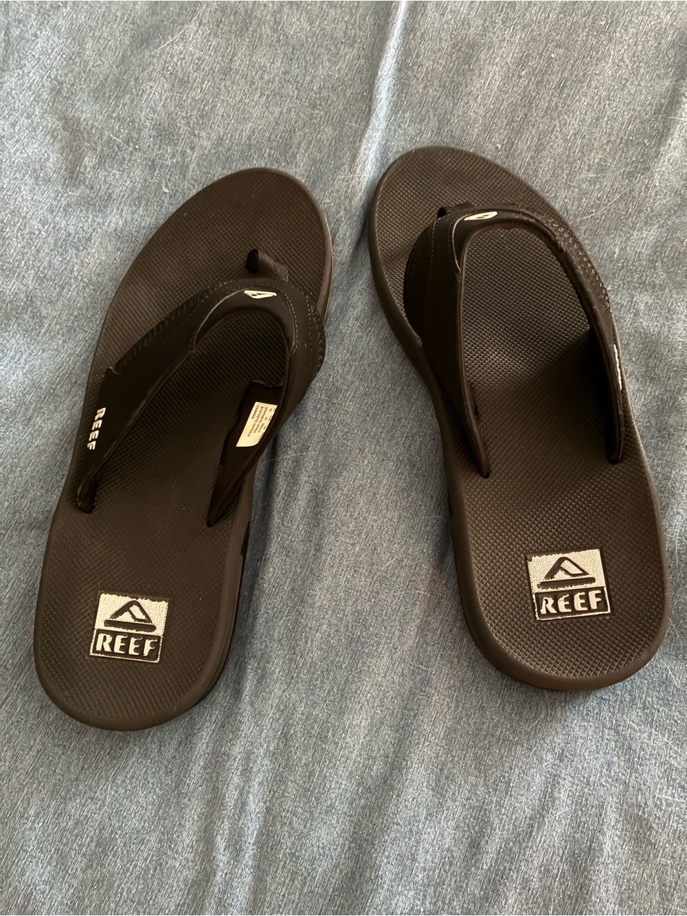 Reef Men’s Black Flip Flops with Logo Footbed